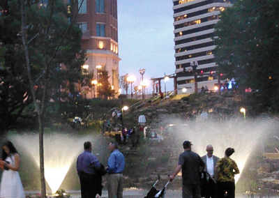 The waterfall traverses the pedestrian steps and ramp encouraging visitors to enter the park.