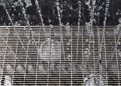 Close up of the grate that houses the splash pad nozzles and lights.